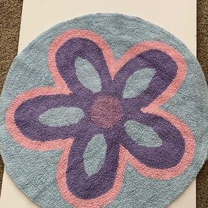 Nobility, kids rug is purple, pink, and teal round 32 inches across